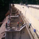 Personnel undertaking core drilling in pier sections