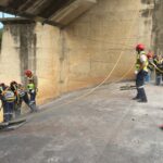 Personnel undertaking core drilling of the spillway