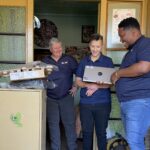 Kagiso-Donga-of-AG-Lubricants-hands-over-a-laptop-to-support-a-learners-education
