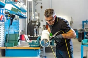 GLS technician working on an Interroll drum motor