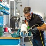 GLS technician working on an Interroll drum motor